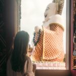 Den tykke, grinende kinesiske Buddha ved Wat Plai Laem Buddhist Temple